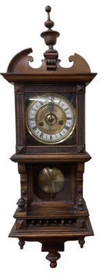 Lot 116 - An early 20th century walnut cased wall clock,...