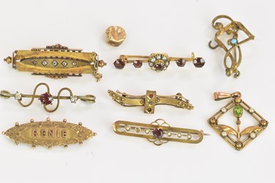 Lot 554 - A group of yellow metal brooches and a tooth...