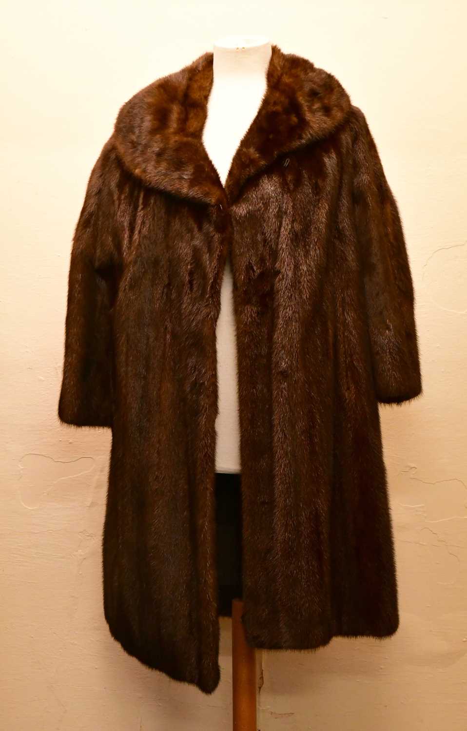 Lot 1959 - HURTIG FURRIERS, CALGARY; a full length dark...