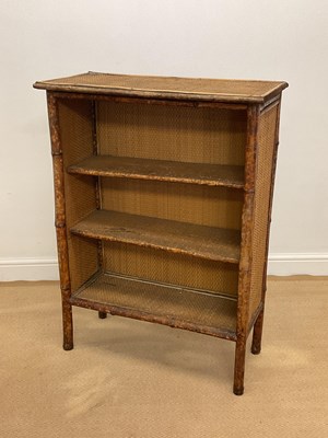 Lot 838 - An early 20th century bamboo open bookcase...