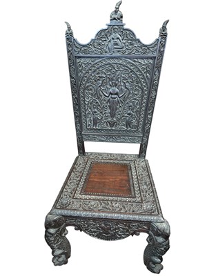 Lot 187 - A Burmese carved hardwood hall chair, with...