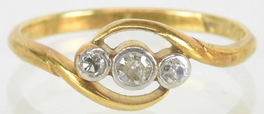 Lot 1529 - An 18ct gold ring with three small bezel set...