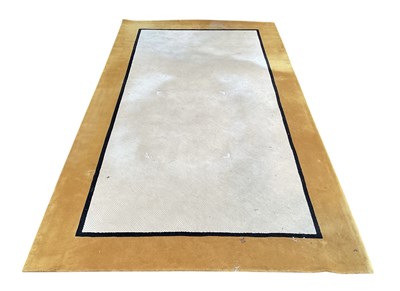 Lot 95 - LOOMAH; a modern cream ground woollen carpet,...