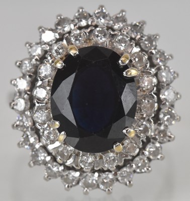 Lot 798 - An 18ct white gold sapphire and diamond...