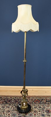 Lot 267 - A gilt brass standard lamp, with cherub base...