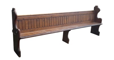 Lot 8 - A large 19th century stained pine church pew,...