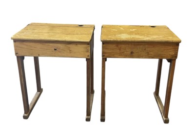 Lot 42 - Two early 20th century light oak school desks,...