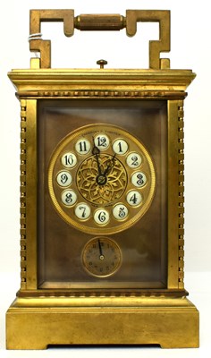 Lot 102 - A 20th century gilt brass carriage clock, with...