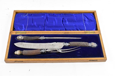 Lot 357 - A late Victorian oak cased three piece carving...
