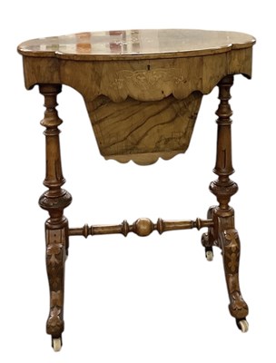 Lot 46 - A Victorian walnut and inlaid sewing table,...