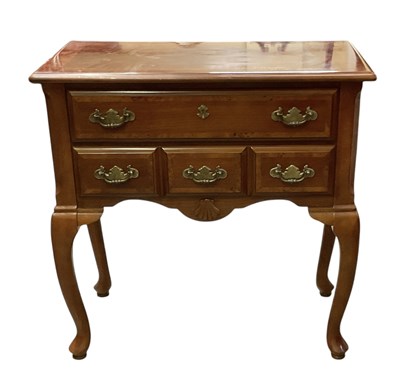 Lot 86 - A reproduction mahogany lowboy, with long...