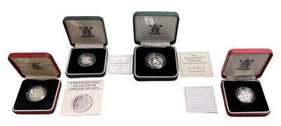 Lot 987 - THE ROYAL MINT; four silver collector's coins...