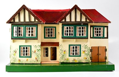 Lot 420 - TRI-ANG; a double-fronted dolls' house with...