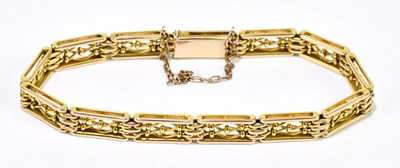 Lot 1246 - A 15ct yellow gold gate bracelet, length 18cm,...