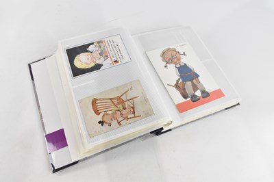 Lot 1069 - A postcard album containing Mabel Lucie...