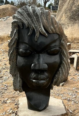 Lot 1005 - M AUGUSTINE; a large African carved...