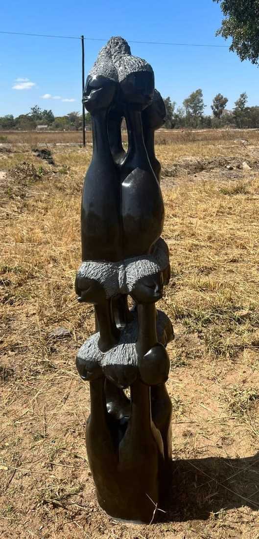 Lot 1012 - A large African carved springstone and...