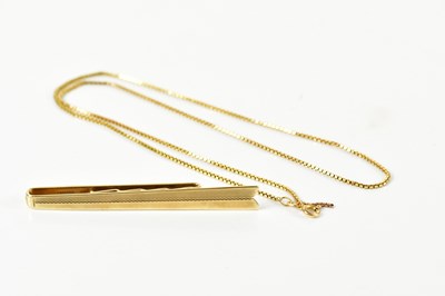 Lot 1207 - A 9ct yellow gold tie slide modelled as an...