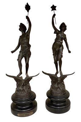Lot 615 - A pair of bronzed spelter figures including...