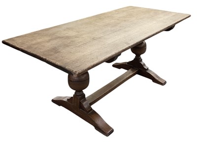 Lot 7 - An early 20th century oak plank top refectory...