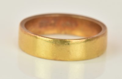 Lot 568 - A 22ct yellow gold wedding band, size Q 1/2,...