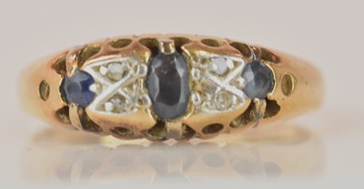 Lot 593 - An 18ct yellow gold platinum tipped sapphire...