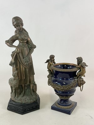 Lot 157 - A large spelter figure of a young woman,...