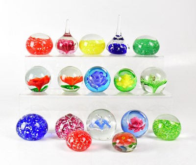 Lot 252 - A collection of glass paperweights to include...