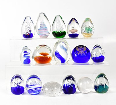 Lot 254 - A collection of glass paperweights to include...