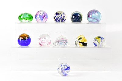 Lot 256 - A collection of glass paperweights to include...