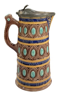 Lot 647 - WEDGWOOD; a majolica slogan jug, with pewter...