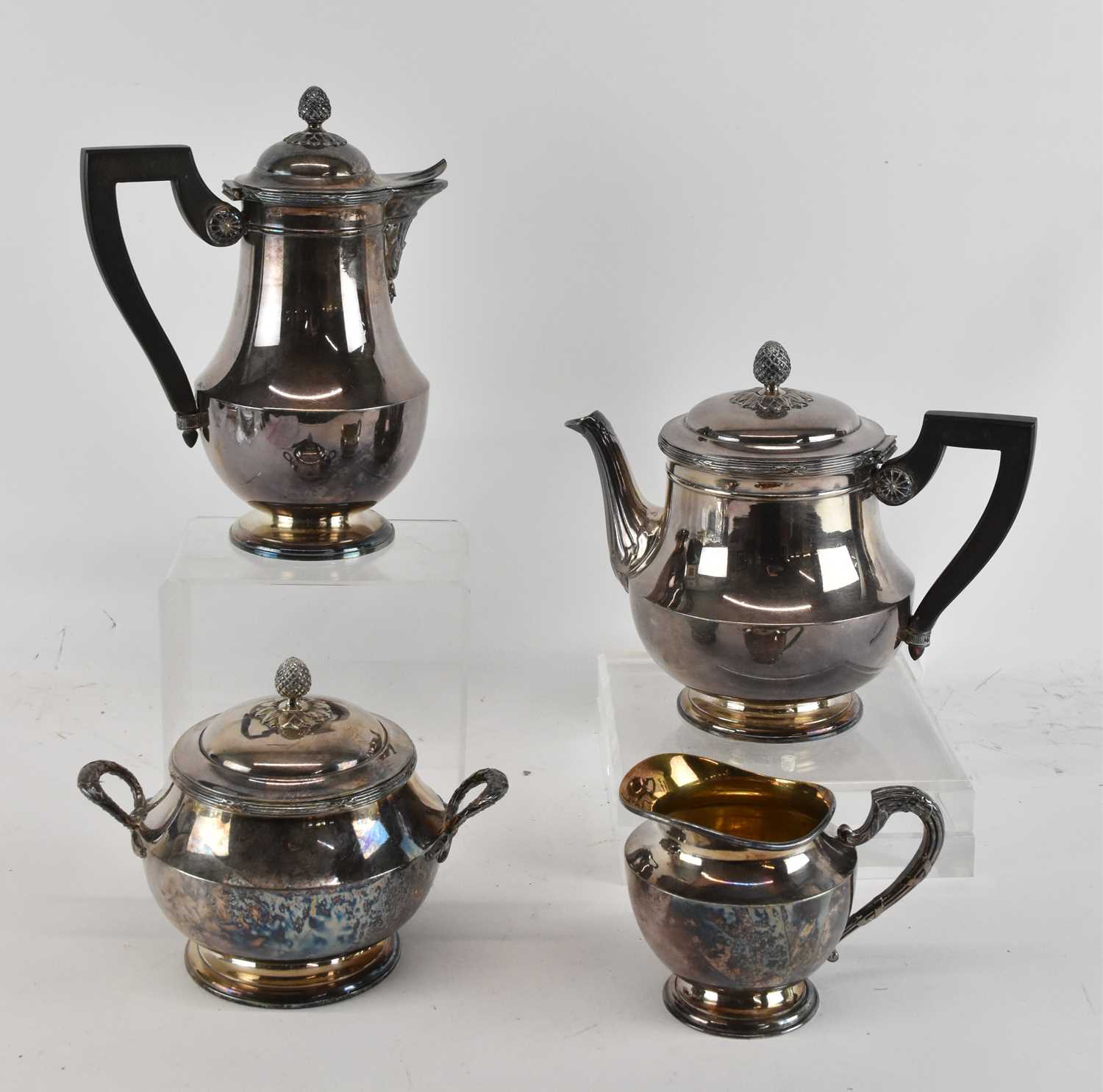 Lot 1231 - CRISTOFLE; a silver plated four piece tea and...
