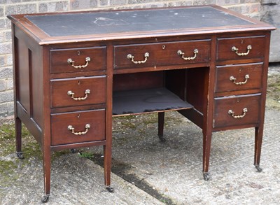 Lot 73C - An Edwardian mahogany seven drawer knee-hole...