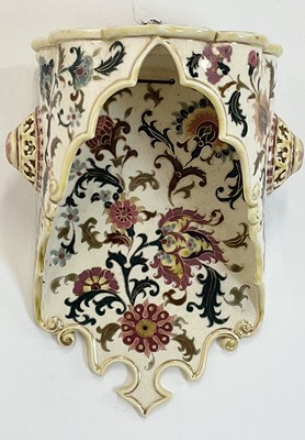 Lot 12 - ZSOLNAY PECS; a floral decorated wall bracket,...