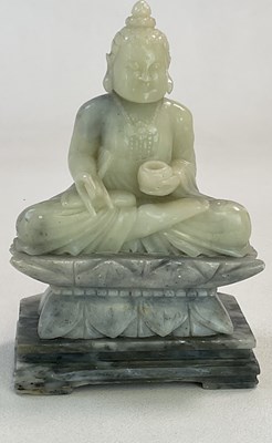 Lot 259 - A Chinese carved soapstone Buddha, modelled on...