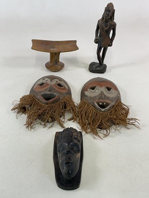 Lot 93 - African tribal items, comprising a carved...