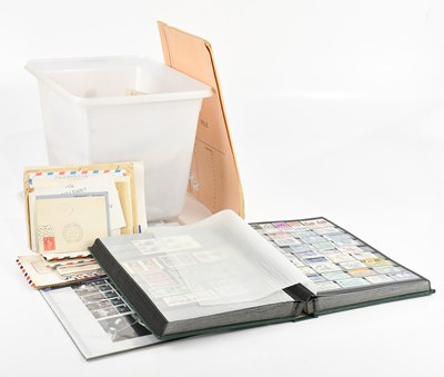 Lot 780 - WORLD STAMPS; in a tub with various covers...
