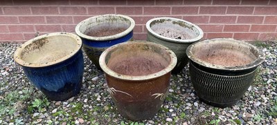 Lot 721 - Five garden plant pots of various designs,...