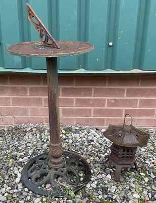 Lot 722 - A cast iron sundial, height 90cm, and pagoda...