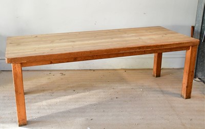 Lot 119 - An old pine refectory kitchen table, on block...