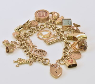 Lot 508 - A 9ct yellow gold charm bracelet set with...