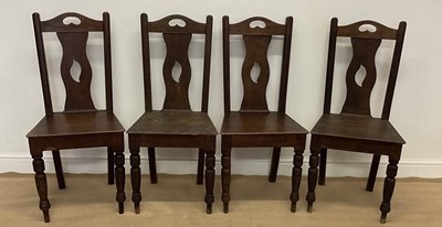 Lot 851 - A set of four oak dining chairs, with pierced...