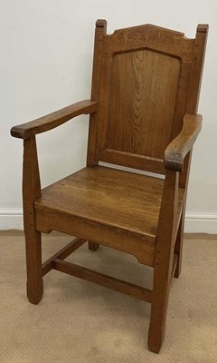 Lot 852 - An oak panel backed elbow chair raised on...