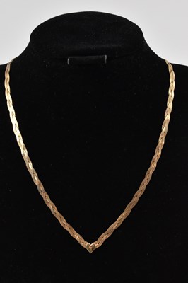 Lot 865 - A 9ct gold flat woven necklace, with heart...