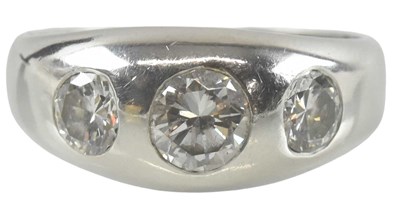 Lot 796 - A platinum three stone diamond set ring, the...