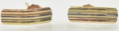 Lot 960 - A pair of tricolour gold earrings, combined...