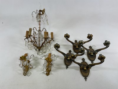 Lot 687 - A chandelier and wall sconces, metal and glass...