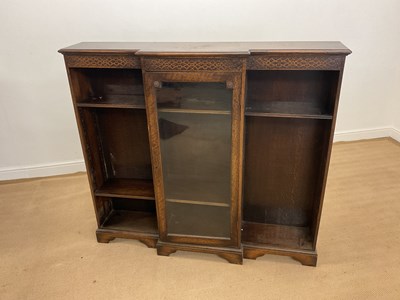 Lot 827 - An early 20th century breakfront oak book case...