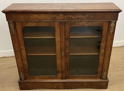 Lot 784 - An inlaid walnut two door pier cabinet with...