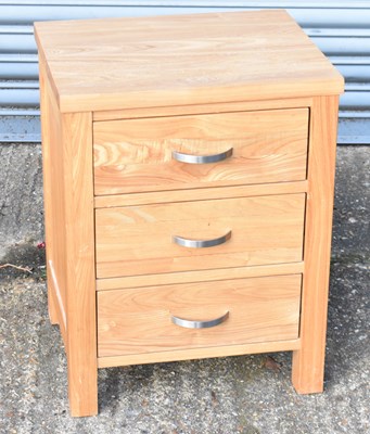 Lot 135 - A modern oak three drawer chest, width 48cm.